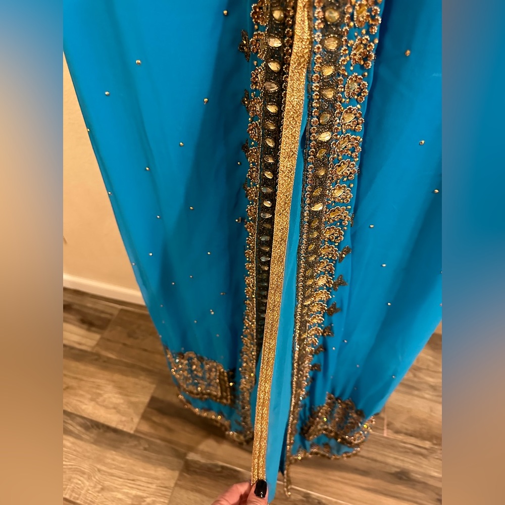 Kuftaan ,very beautiful piece and heavy with all the pieces on it as you see it